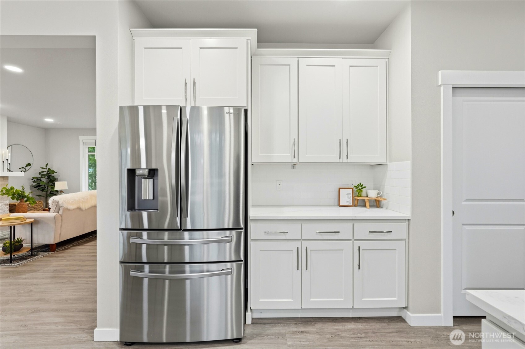 37311 142nd Place Southeast Sultan, WA 98294 - Photo 16 of 35 a kitchen with kitchen island white cabinets and stainless steel appliances