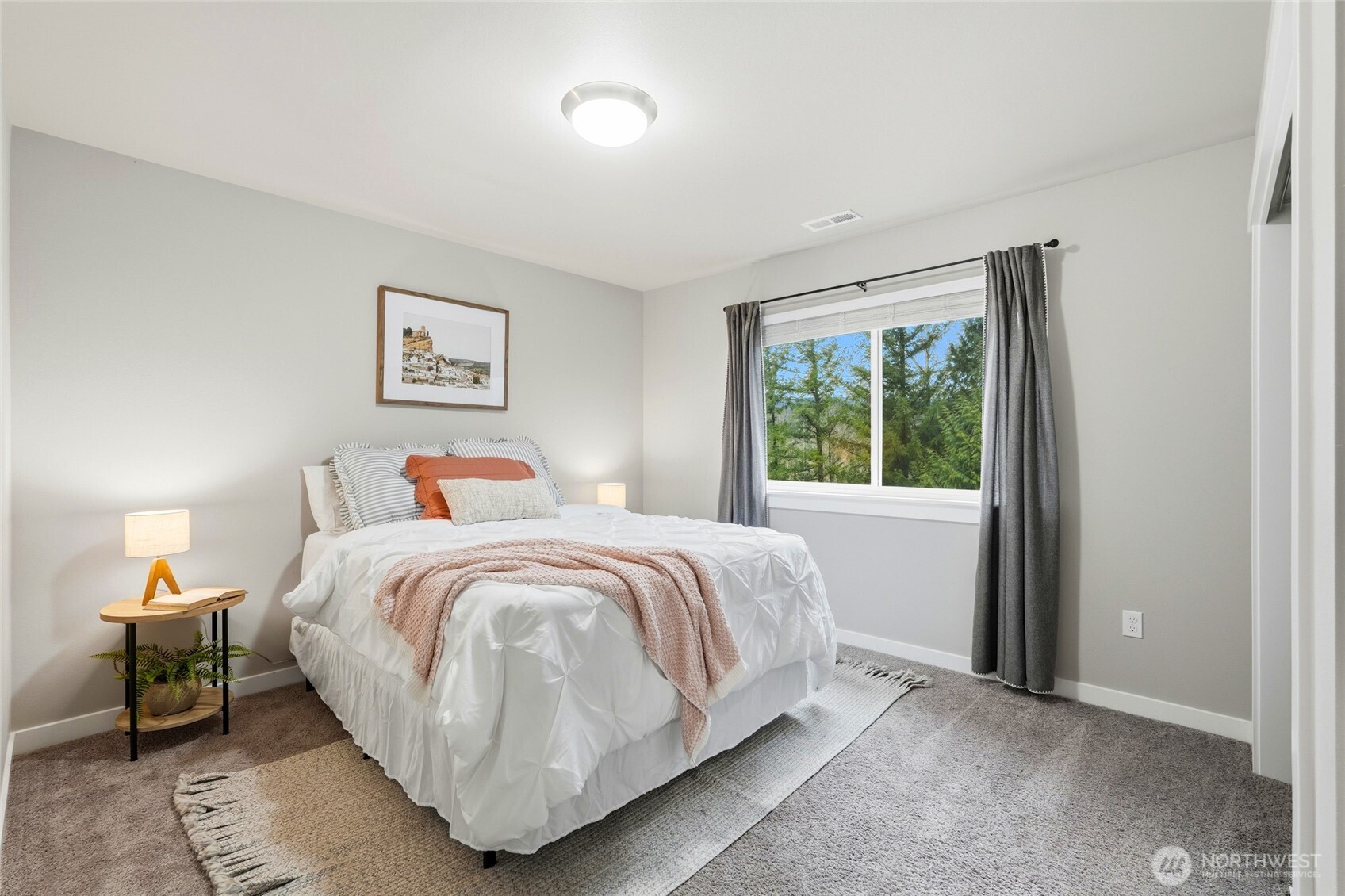 37311 142nd Place Southeast Sultan, WA 98294 - Photo 20 of 35 a bedroom with a bed and a painting on the wall