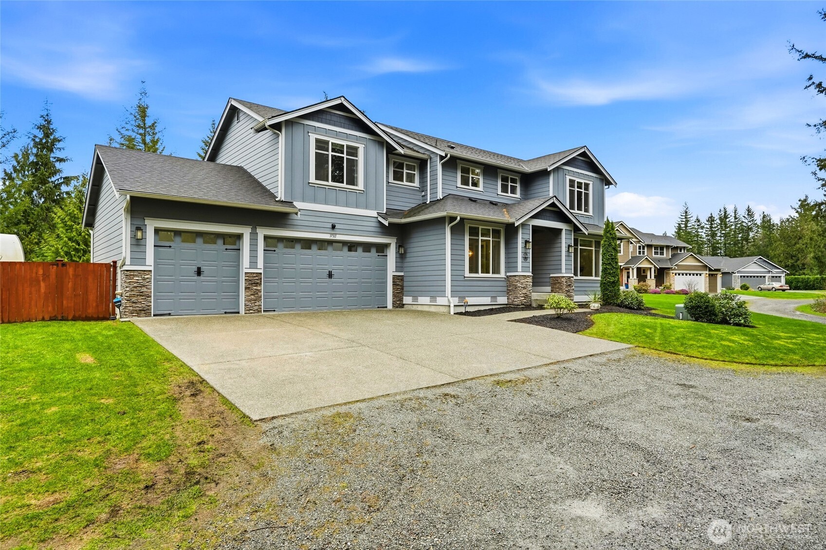 37311 142nd Place Southeast Sultan, WA 98294 - Photo 27 of 35 a front view of a house with a yard and garage