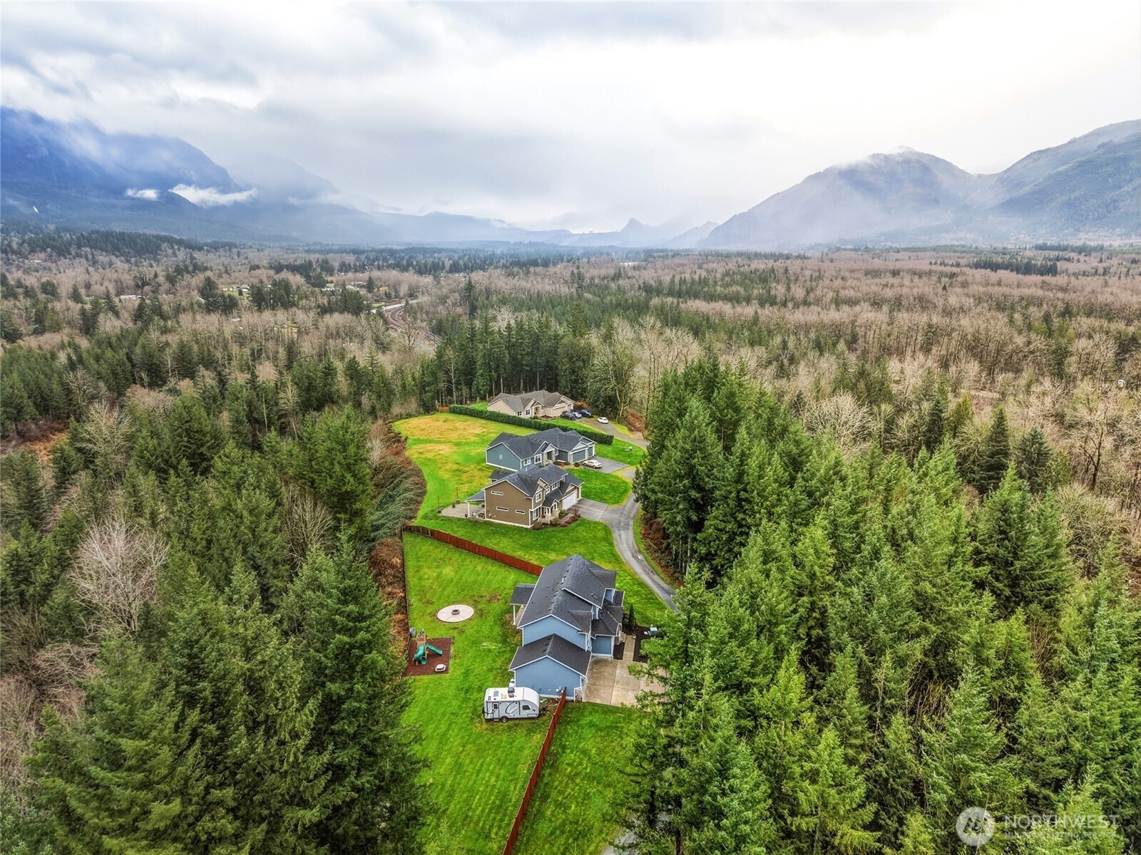 37311 142nd Place Southeast Sultan, WA 98294 - Photo 33 of 35 a view of a city with lush green forest