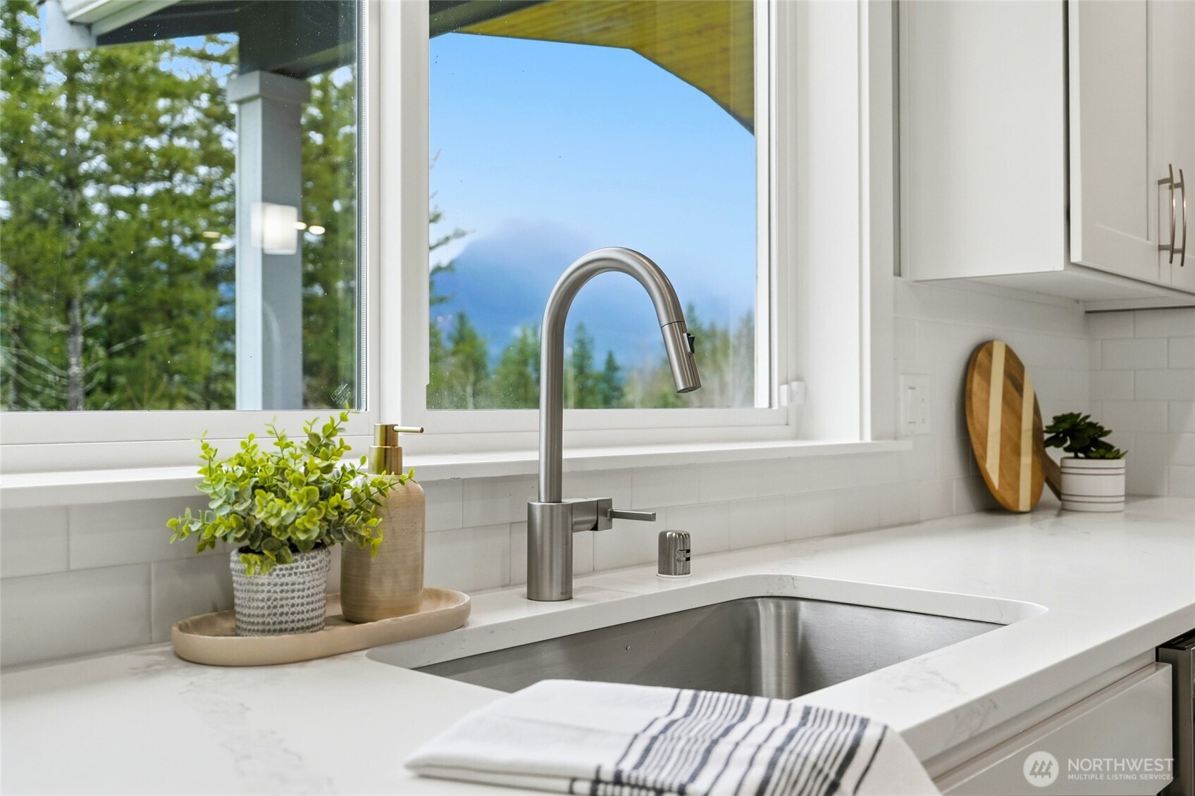 37311 142nd Place Southeast Sultan, WA 98294 - Photo 6 of 35 a kitchen with a faucet a sink and a window