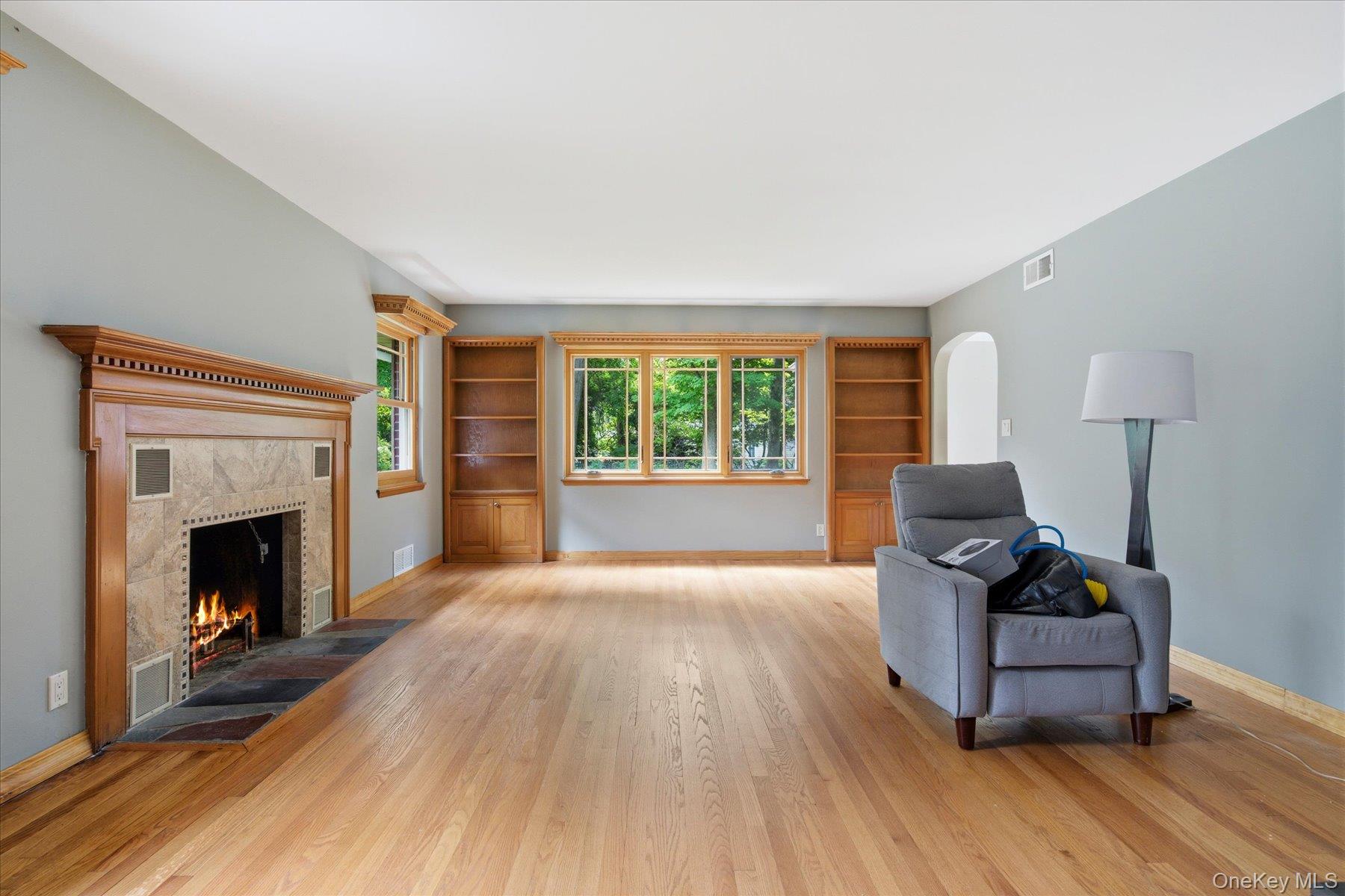 42 Cliff Road Port Jefferson, NY 11777 - Photo 4 of 22 a living room with furniture and a fireplace