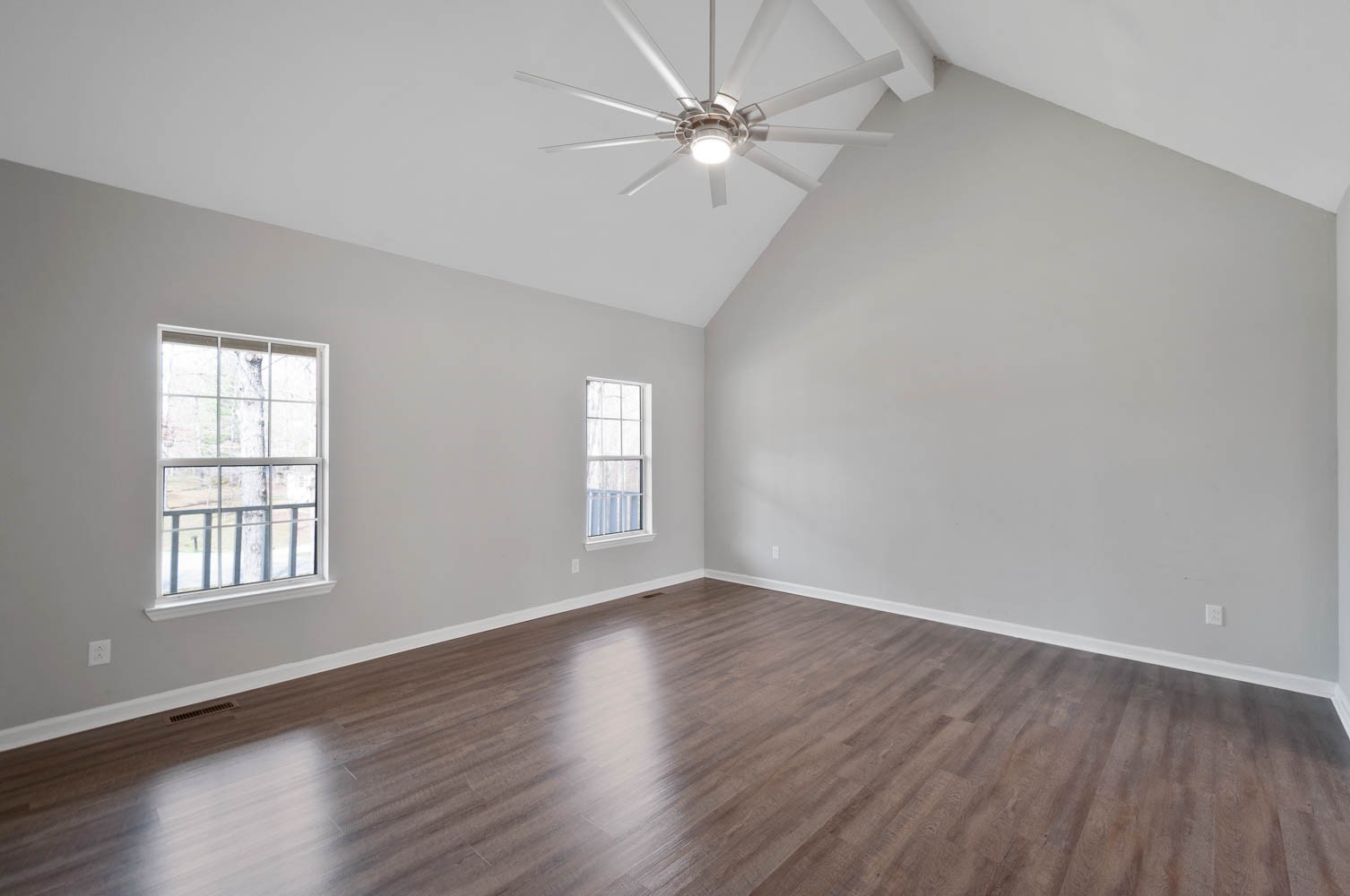 1004 Edwin Road Dickson, TN 37055 - Photo 5 of 36 an empty room with wooden floor ceiling fan and windows