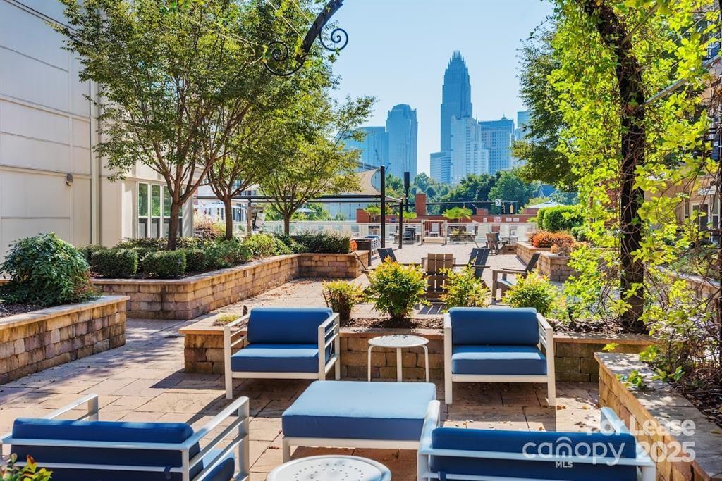 902 West 4th Street, Unit CEDAR Charlotte, NC 28202 - Photo 23 of 24 a view of a patio with couches table and chairs and potted plants