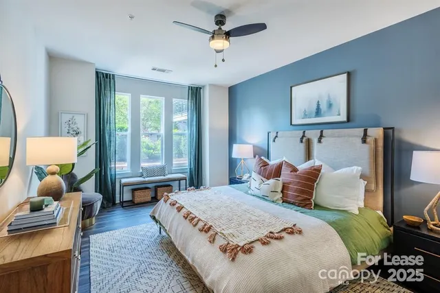 a bedroom with a large bed and a window