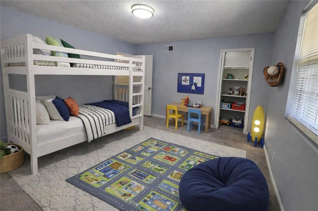 3543 Old Chamblee Tucker Road, Unit D Atlanta, GA 30340 - Photo 17 of 22 a living room with furniture and a fireplace