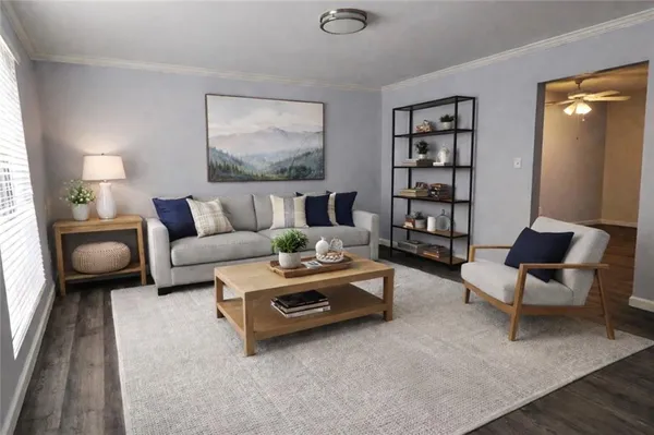 a living room with furniture and wooden floor