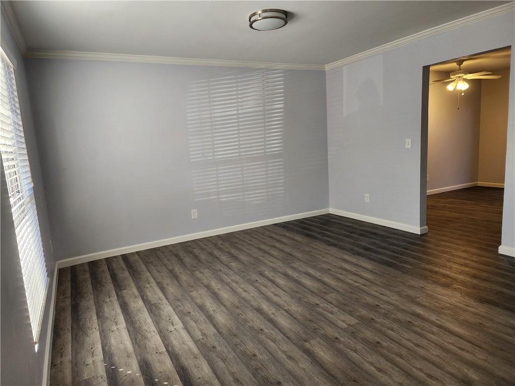 3543 Old Chamblee Tucker Road, Unit D Atlanta, GA 30340 - Photo 5 of 22 an empty room with wooden floor and windows