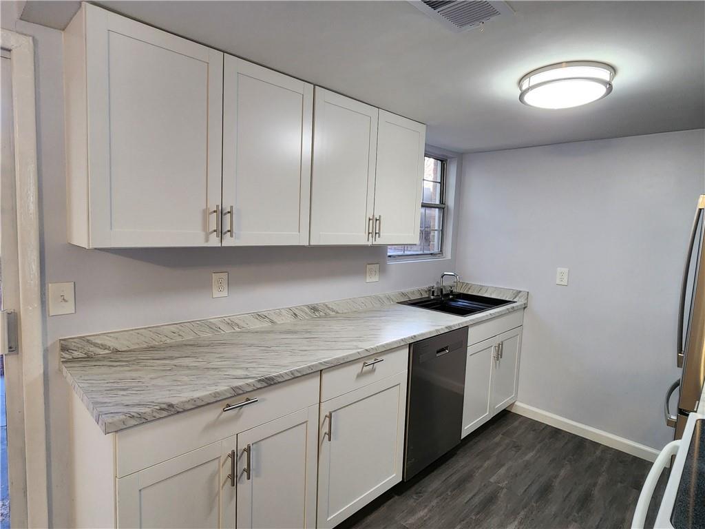 3543 Old Chamblee Tucker Road, Unit D Atlanta, GA 30340 - Photo 10 of 22 a kitchen with a sink and cabinets