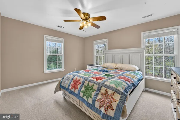a bathroom with double vanity sink and a mirror