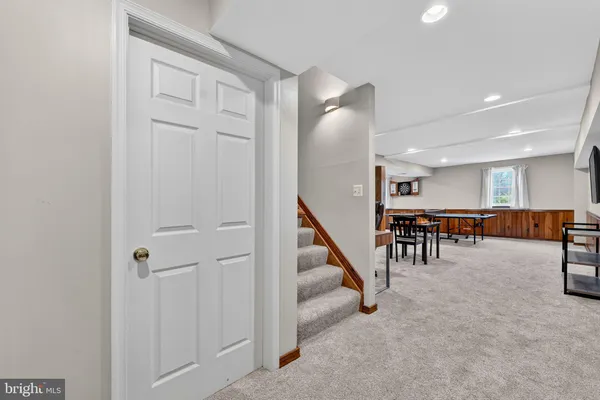 a room with furniture and air hockey table