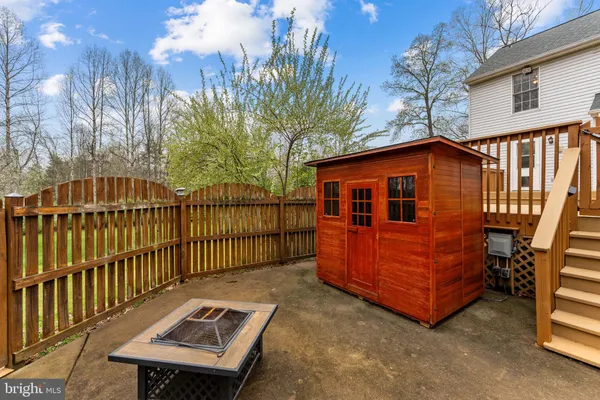 a view of backyard with deck and couch