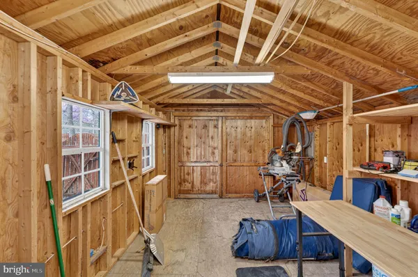 a view of a wooden house with a yard