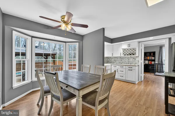 a kitchen with stainless steel appliances white cabinets and a sink