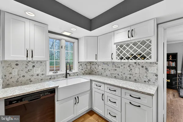 a kitchen with stainless steel appliances granite countertop a refrigerator stove microwave and sink