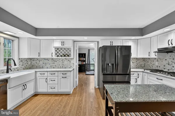 a kitchen with a sink and large window