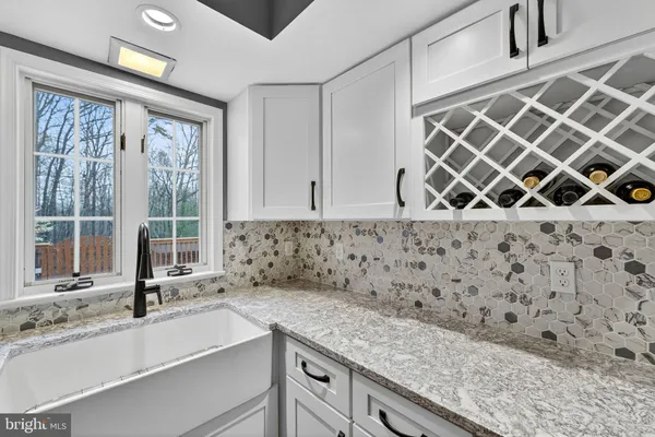 a living room with furniture and a book shelf