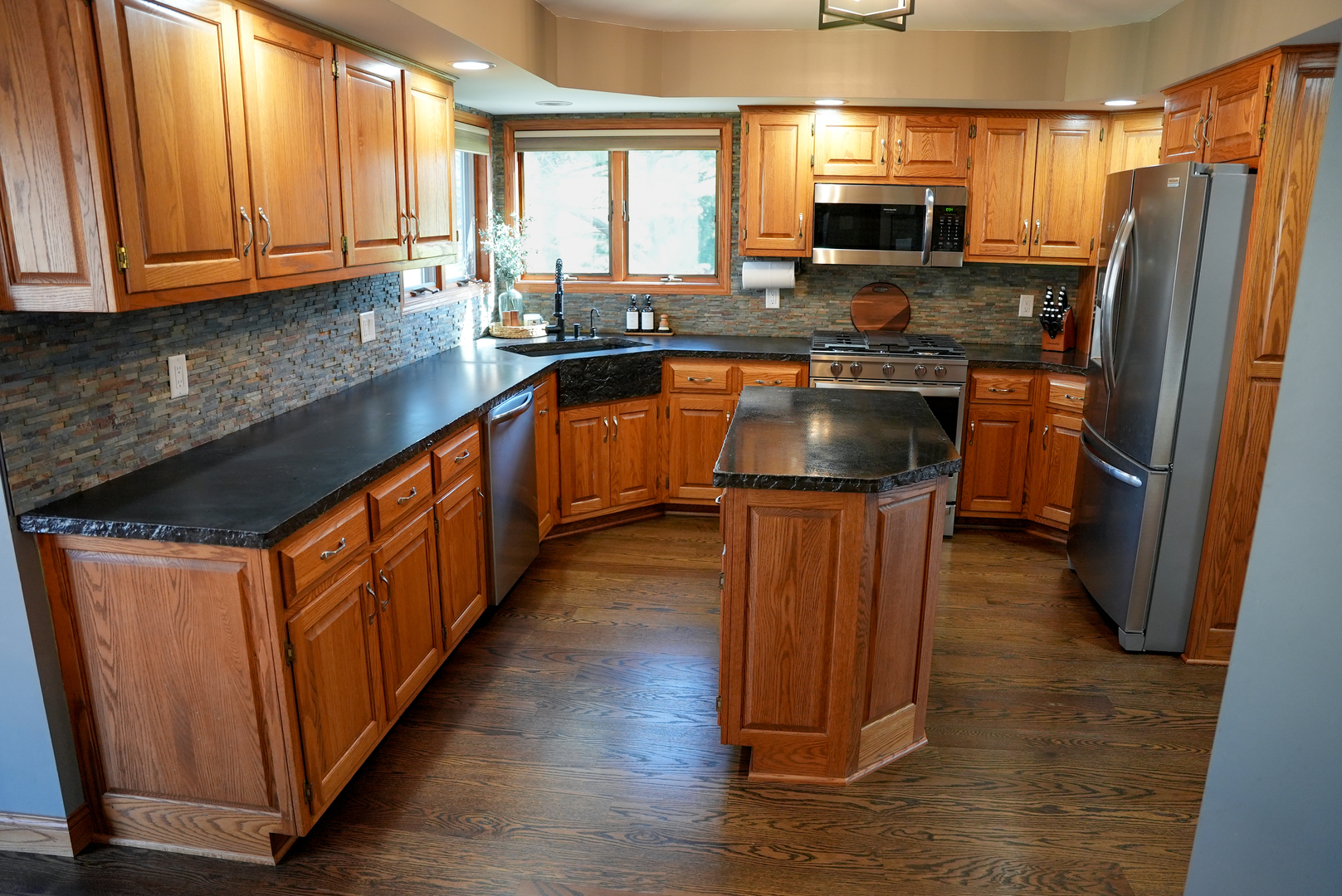19410 Timber Drive North Elwood, IL 60421 - Photo 11 of 26 a kitchen with stainless steel appliances granite countertop a stove a sink dishwasher a refrigerator and a oven