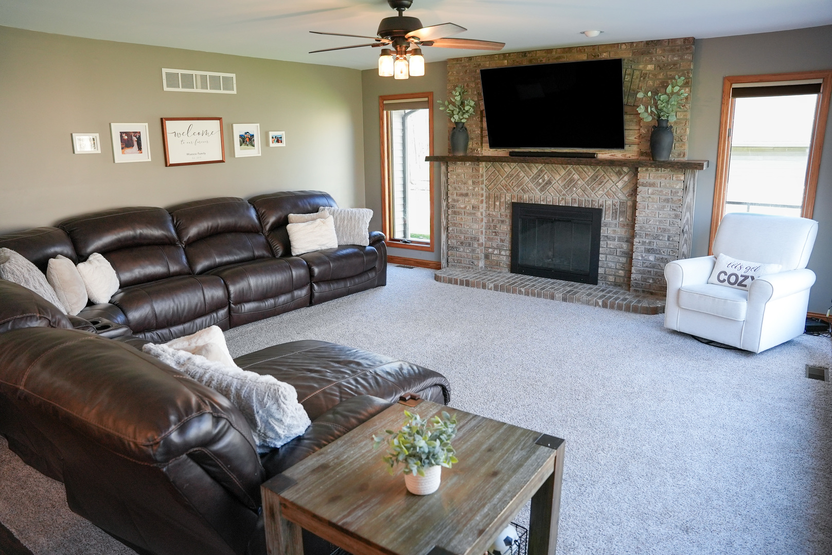19410 Timber Drive North Elwood, IL 60421 - Photo 12 of 26 a living room with furniture a flat screen tv and a fireplace