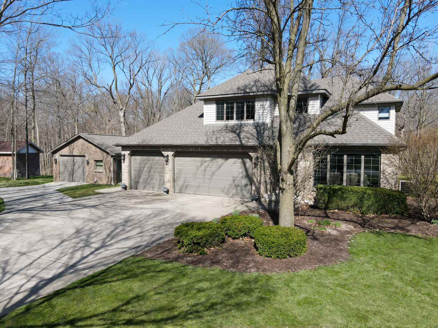 19410 Timber Drive North Elwood, IL 60421 - Photo 3 of 26 a front view of a house with garden