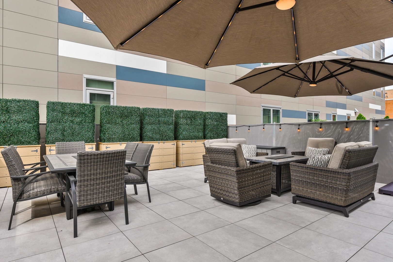 1100 West Adams Street, Unit 2N Chicago, IL 60607 - Photo 20 of 23 a view of a patio with couches chairs under an umbrella