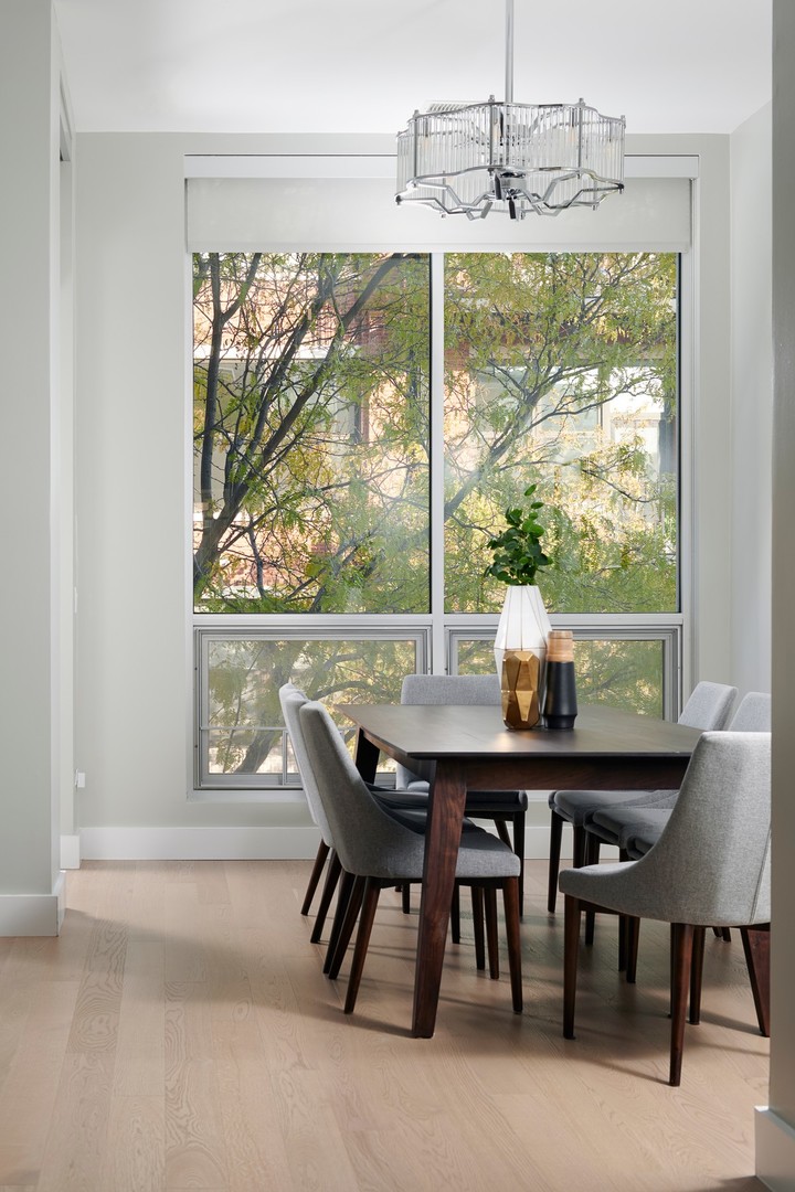 1100 West Adams Street, Unit 2N Chicago, IL 60607 - Photo 9 of 23 a view of a dining room with furniture window and outside view