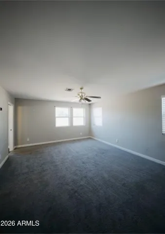 a view of empty room with windows