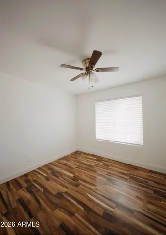 a view of room with window and ceiling fan
