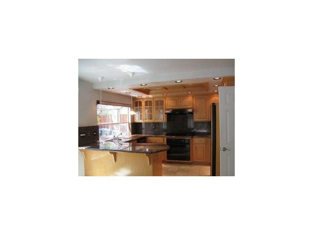 512 Hamilton Avenue Milpitas, CA 95035 - Photo 2 of 8 a kitchen with a sink and cabinets