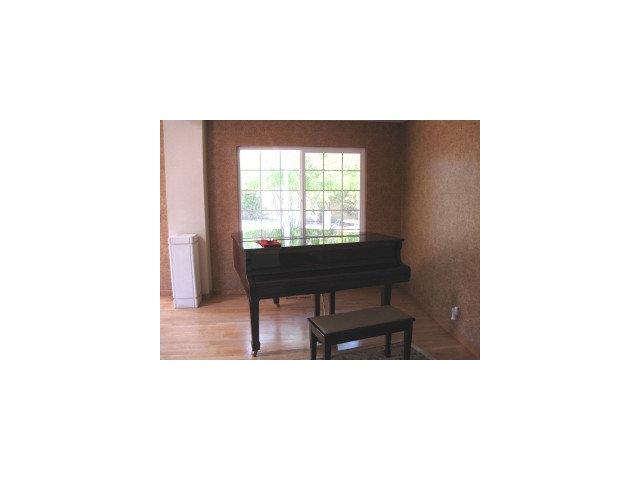 512 Hamilton Avenue Milpitas, CA 95035 - Photo 3 of 8 a picture of a living room with a table and a chair