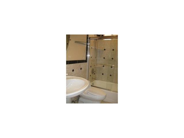 512 Hamilton Avenue Milpitas, CA 95035 - Photo 6 of 8 a bathroom with a toilet a sink and mirror
