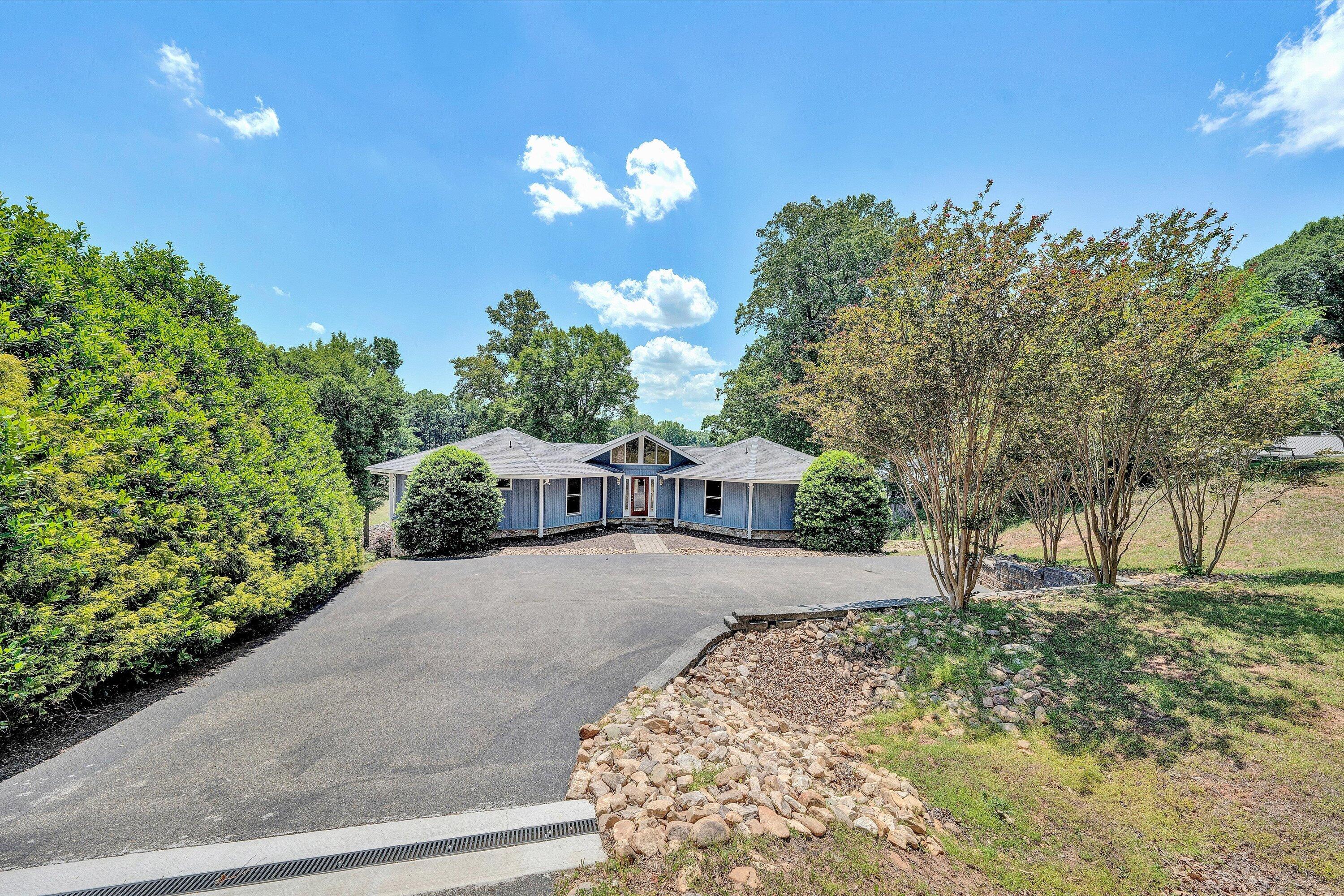 207 Winding Way Union Hall, VA 24176 - Photo 3 of 60 a front view of a house with a yard