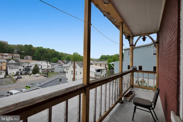 a outdoor dining space with lots of furniture and appliances