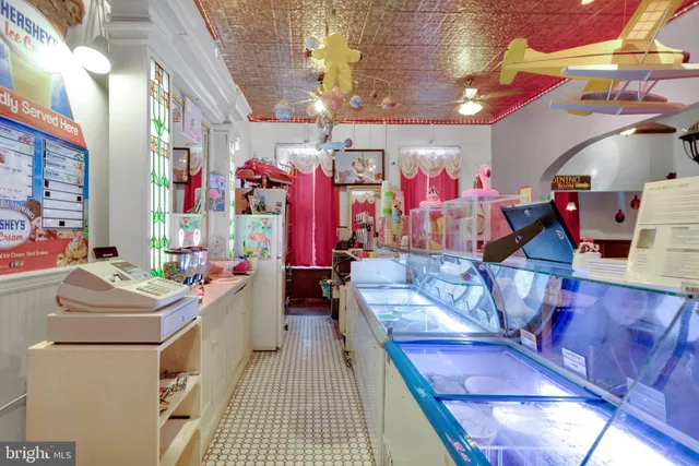 a kitchen with a sink a stove and cabinets