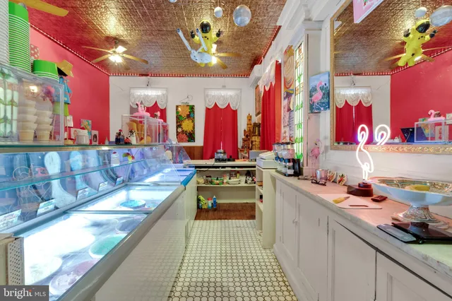 a kitchen with stainless steel appliances granite countertop a sink and a stove
