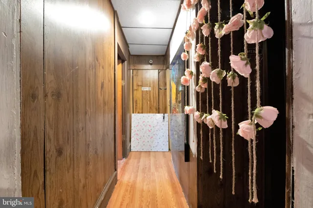 a bathroom with a granite countertop sink and a toilet
