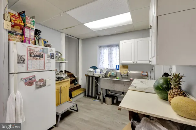 a view of a chairs and table in backyard