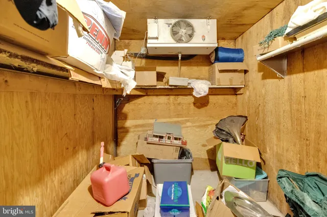 an aerial view of a house with a yard wooden table and chairs