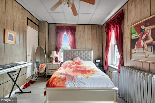 a bedroom with a bed and window