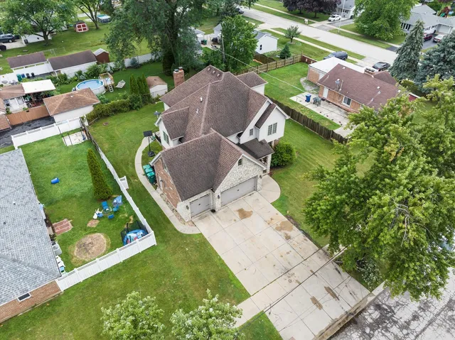 an aerial view of a house with outdoor space