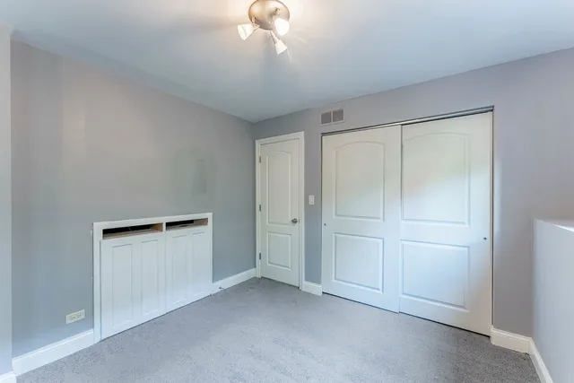 a view of an empty room with a bathroom