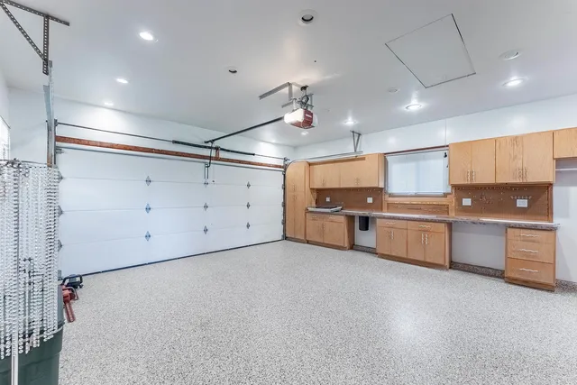a large kitchen with cabinets and stainless steel appliances