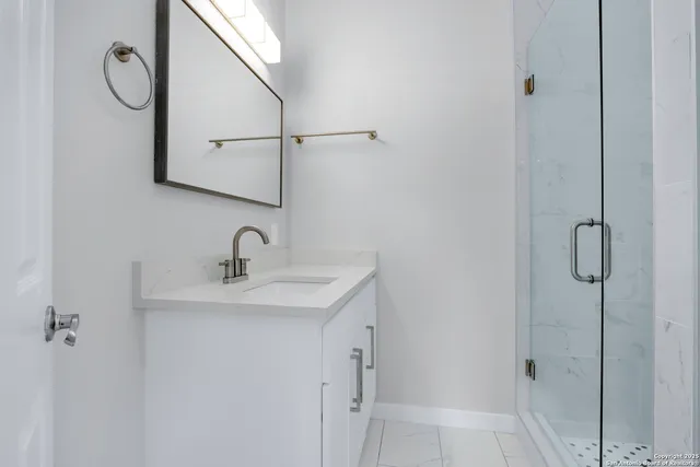 a bathroom with a sink and a mirror