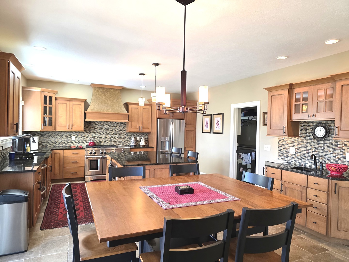 9667 Crossbow Drive Bloomington, IL 61705 - Photo 27 of 54 a large kitchen with a table and chairs