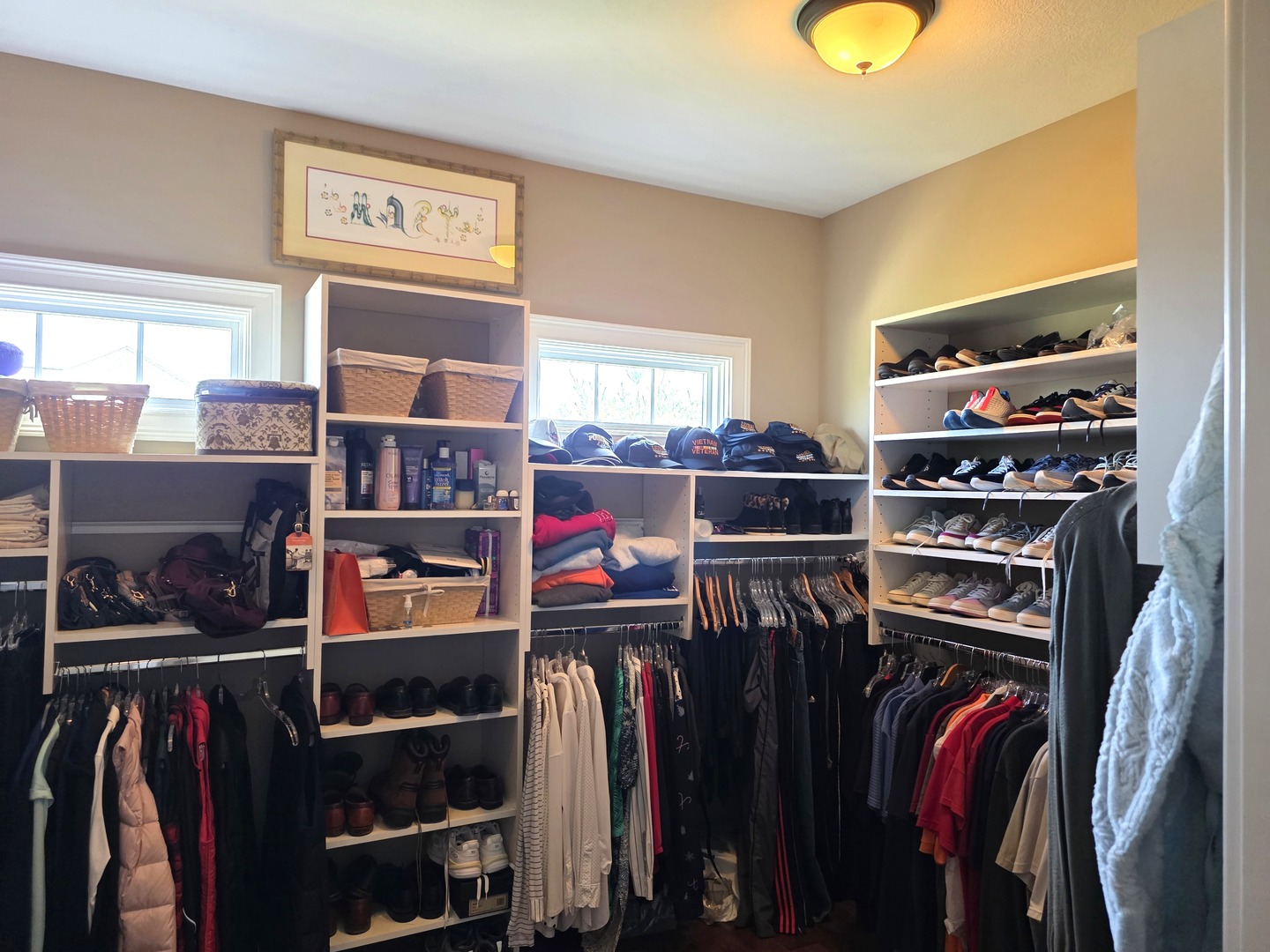 9667 Crossbow Drive Bloomington, IL 61705 - Photo 30 of 54 a view of walk in closet with clothes and shoes