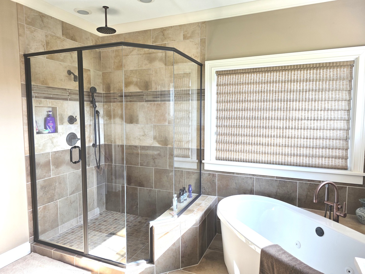 9667 Crossbow Drive Bloomington, IL 61705 - Photo 34 of 54 a bathroom with a bathtub and a shower