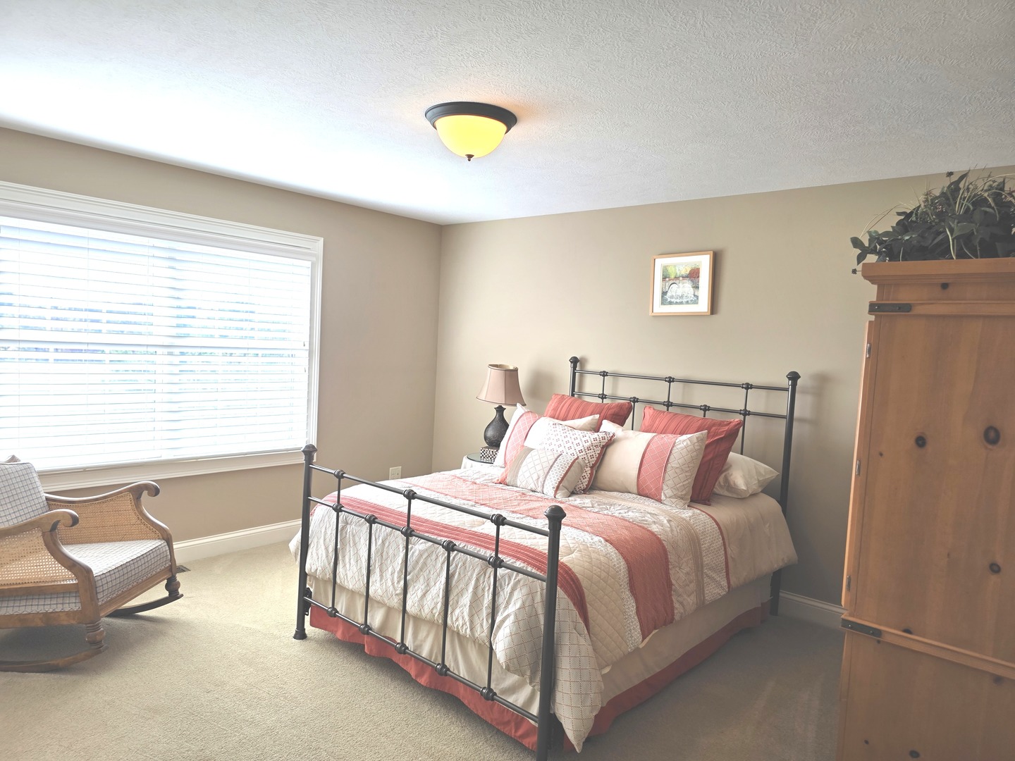 9667 Crossbow Drive Bloomington, IL 61705 - Photo 35 of 54 a bedroom with a bed and a chandelier