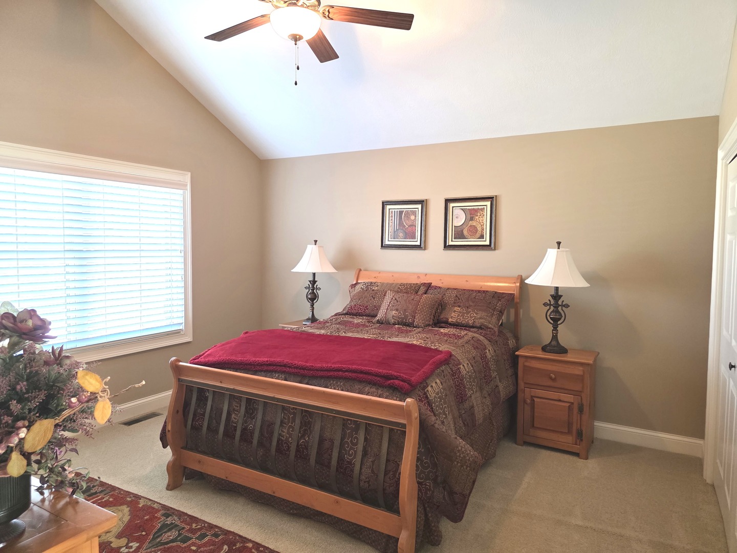 9667 Crossbow Drive Bloomington, IL 61705 - Photo 37 of 54 a bedroom with a bed and a chandelier