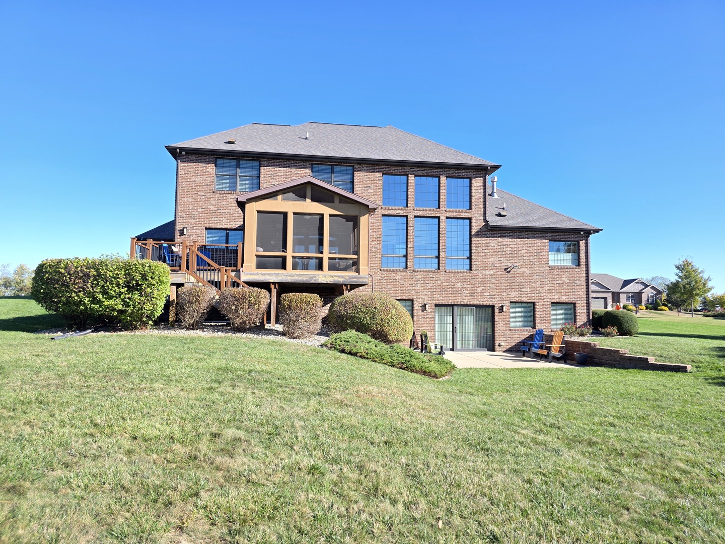 9667 Crossbow Drive Bloomington, IL 61705 - Photo 6 of 54 a front view of a house with a yard