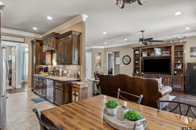 a kitchen with sink a stove and cabinets